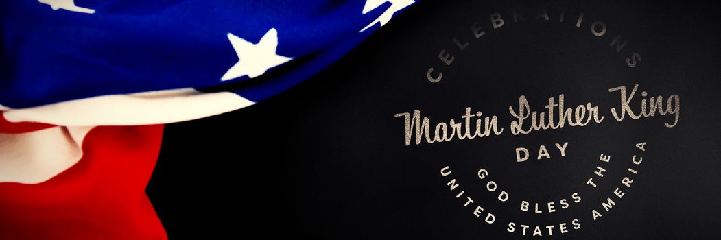 Martin Luther king day against american flag against black background