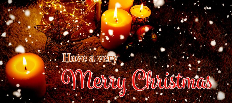 Christmas card against christmas candles and decorations