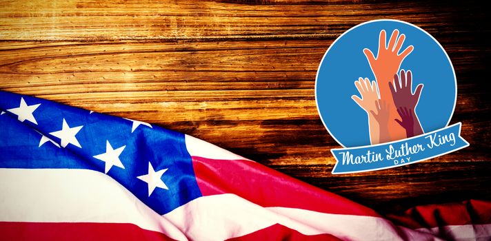 Martin Luther king day with hands against usa flag on table
