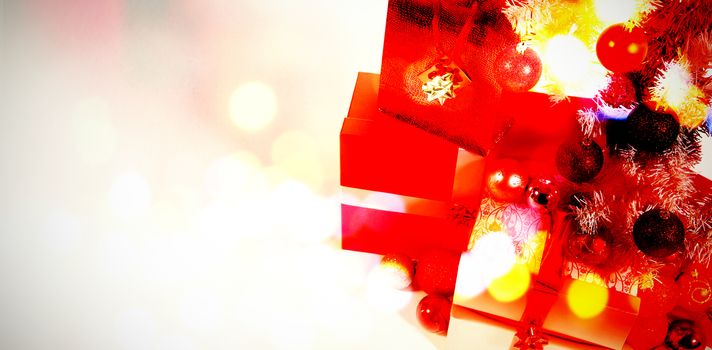 Composite image of table against christmas gifts with copy space