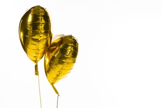 Close-up of Valentine balloons against white background