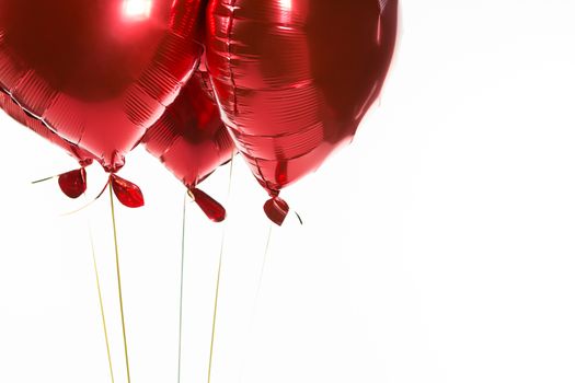 Close-up of Valentine balloons against white background
