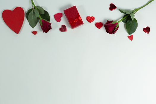 Overhead of Valentine gifts and decorations on white background