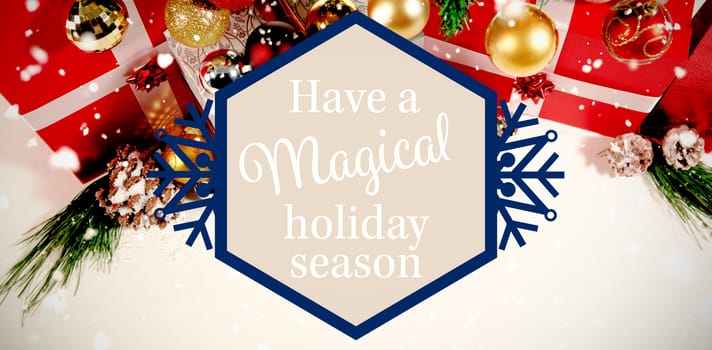 snowflake "have a magical holiday season" against christmas decoration against white background