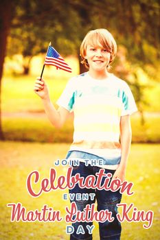 Portrait of boy with American flag against join the celebration event martin luther king day