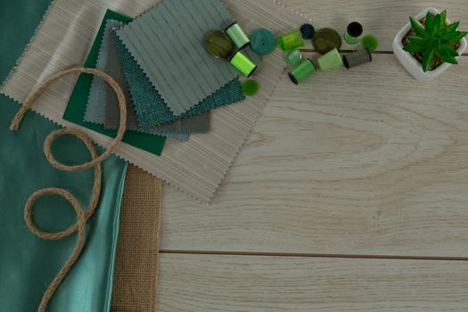 Overhead of textile and thread rolls on a table