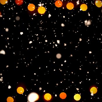 Snow falling against copy space with unfocused garland