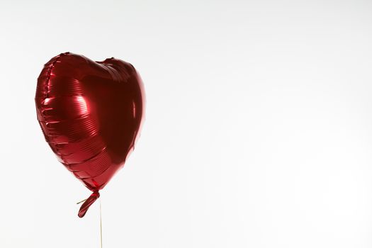 Close-up of Valentine balloon against white background