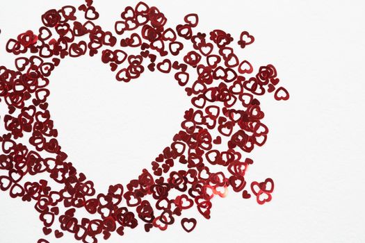Close-up of heart shape decorations arranged on white background