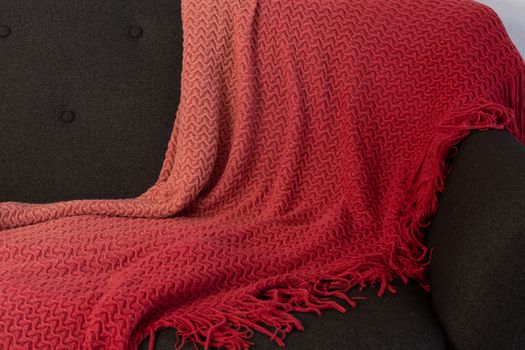 Close-up of blanket arranged on sofa