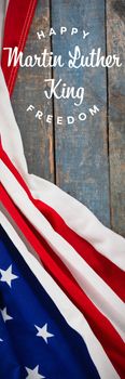 happy Martin Luther King freedom against american flag on a wooden table