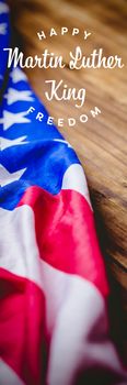 happy Martin Luther King freedom against usa flag on table