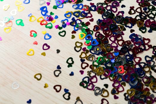Close-up of Heart shape decorations scattered on white background