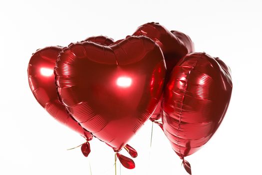 Close-up of Valentine balloons against white background