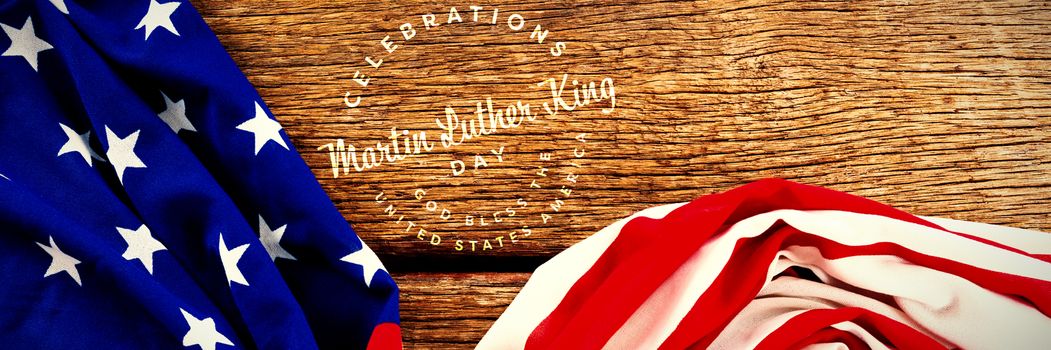 Martin Luther king day against american flag on wooden table