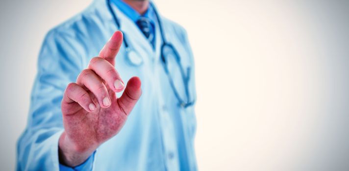 Midsection of doctor touching digital screen against white background