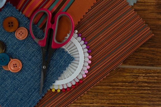 Overhead of textile and various equipments on a table