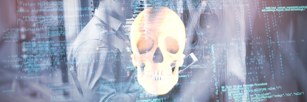 Composite image of binary codes against orange human skull