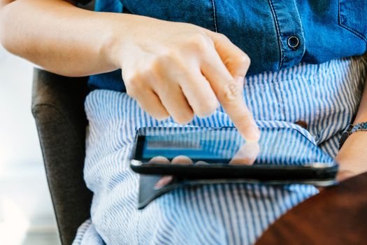 image of people using a digital tablet