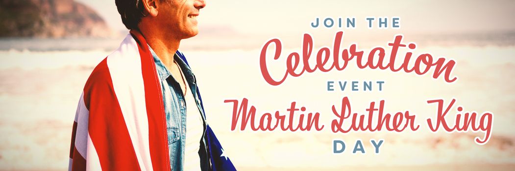 join the celebration event Martin Luther King Day against man wrapped in amrican flag standing on beach
