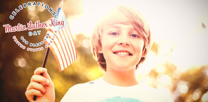 Low angle view of boy with American flag against martin luther king day