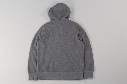 Close-up of hoodie jacket on white background