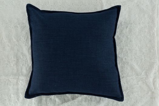 Close-up of cushion on textile