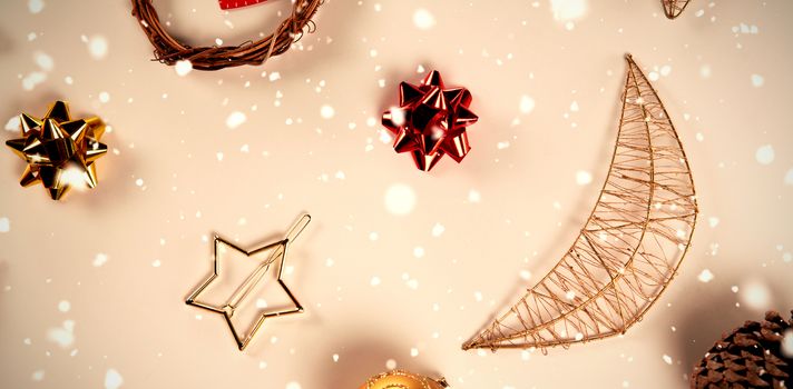 Snow falling against close up on christmas ornaments