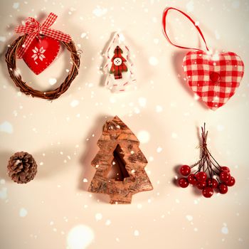 Snow falling against two rows of christmas decorations