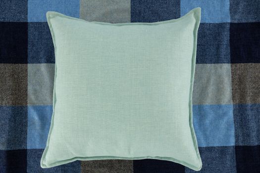 Close-up of cushion on textile