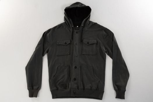 Close-up of hoodie jacket on white background