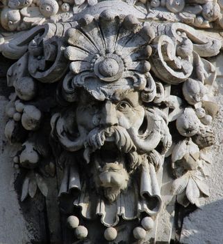 Budapest, Hungary, building facade with ornate statue head.