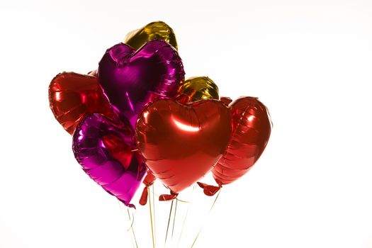 Close-up of Valentine balloons against white background