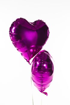 Close-up of Valentine balloons against white background