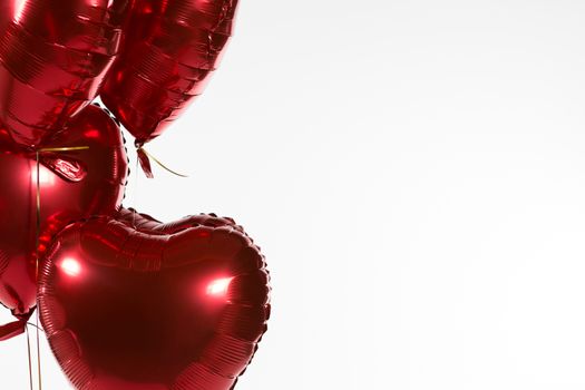 Close-up of Valentine balloons against white background