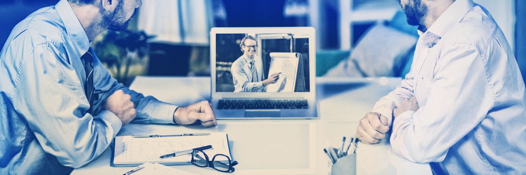 Businessmen having video conference in conference room at office