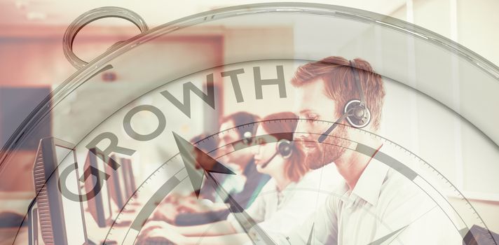 Compass pointing to growth against businessman typing on keyboard at call center