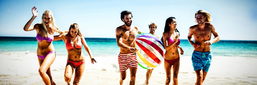  Friends having fun at the beach on a sunny day