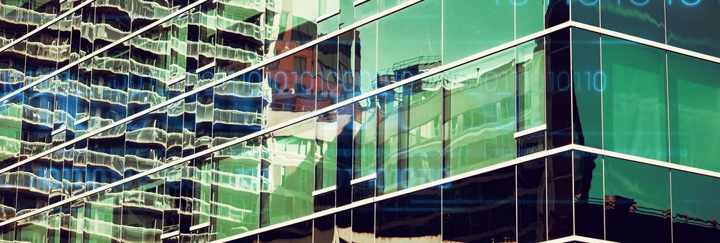 interface against close-up of glass office building 