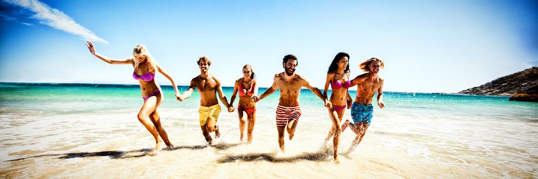  Friends having fun at the beach on a sunny day