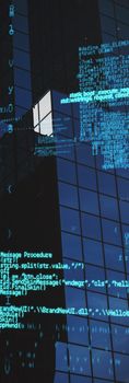 Blue codes against close-up of glass office building 