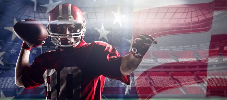 American football player standing with helmet preparing to throw ball against close-up of an american flag