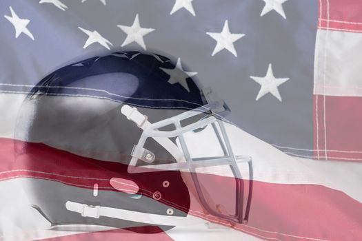Close up of black sports helmet against close-up of an american flag