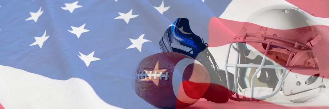 American football with sports helmet and shoe against american flag with stars and stripes