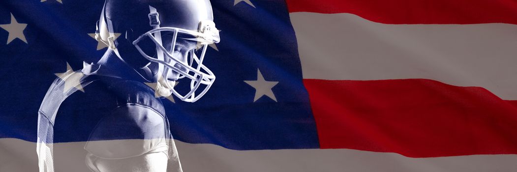 Close-up of US flag against american football player in helmet standing against black background