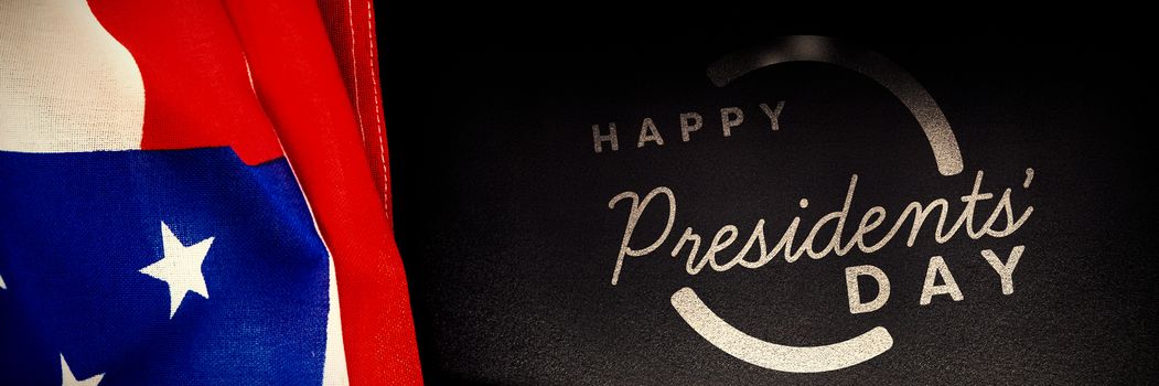 Happy presidents day. Vector typography against american flag on black background