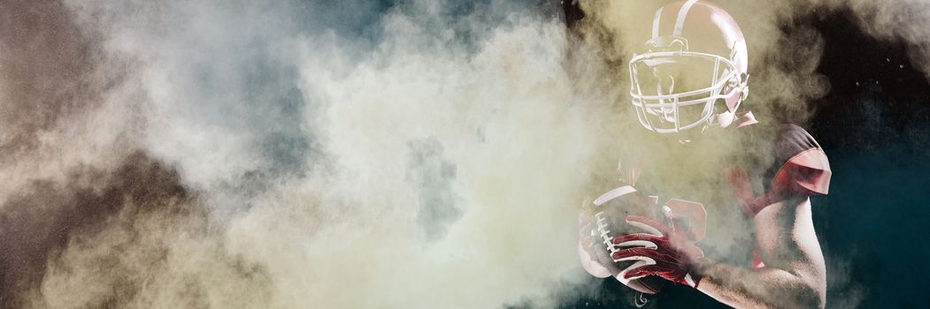 Splashing of powder against american football player in helmet holding rugby ball