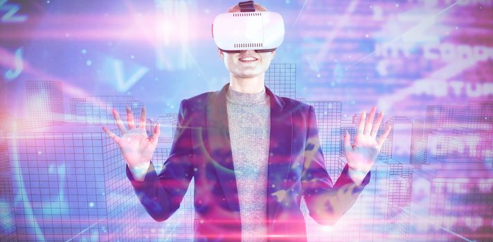 Happy businesswoman gesturing while wearing vr glasses against blue and red technology interface