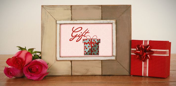 Cute Valentines Day message in Frame on desk with gifts and petals