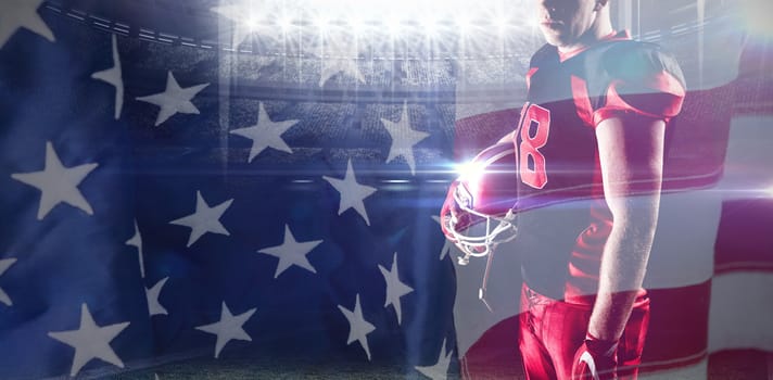 Volleyball player holding rugby helmet against close-up of an american flag